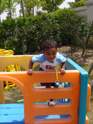 Ariel climbing in Backyard